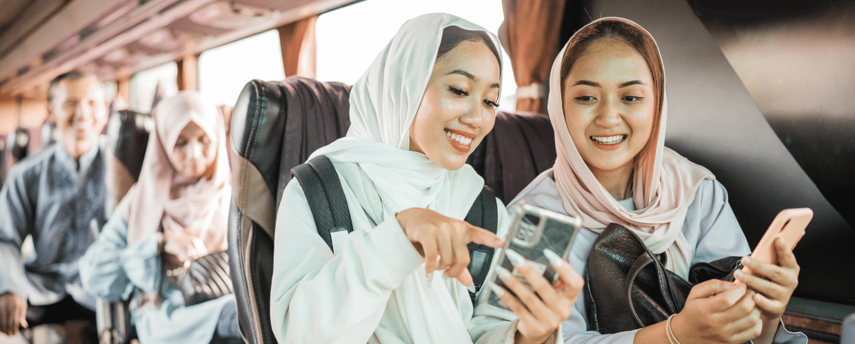 indonesian woman on a bus showing phone