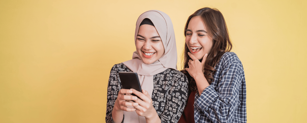 asian woman looking at phone