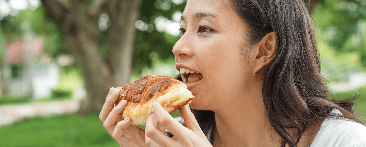 asian-woman-eating-bread